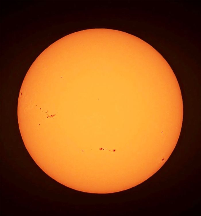 about-us-img A high-resolution image of the sun showing prominent sunspots, captured in East Islip, NY.